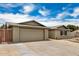 Home showcasing a two-car garage, brickwork facade, and landscaped front yard at 5101 E Toniko Dr, Phoenix, AZ 85044