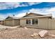 Residential house featuring low-maintenance landscaping and a two-car garage at 5101 E Toniko Dr, Phoenix, AZ 85044