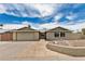 Charming single-story home featuring a stone walkway and a spacious two-car garage at 5101 E Toniko Dr, Phoenix, AZ 85044