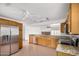 Traditional kitchen featuring granite countertops, stainless steel appliances, and tile flooring at 5101 E Toniko Dr, Phoenix, AZ 85044