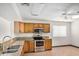 Functional kitchen offering stainless steel appliances, granite countertops and wooden cabinets at 5101 E Toniko Dr, Phoenix, AZ 85044