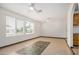 Bright living room featuring tile floors, ceiling fans, and abundant natural light at 5101 E Toniko Dr, Phoenix, AZ 85044