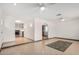 Bright living room featuring tile floors, skylight, ceiling fans, and neutral-toned walls at 5101 E Toniko Dr, Phoenix, AZ 85044