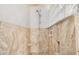 Enclosed shower with a mosaic tile floor and glass block window, creating a spa-like retreat at 5101 E Toniko Dr, Phoenix, AZ 85044