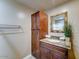 Bathroom featuring a granite vanity, a large cabinet, and a towel rack at 6519 E Cactus Rd, Scottsdale, AZ 85254
