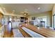 Open concept living area with kitchen, dining, living, and game room. Large fireplace included at 6519 E Cactus Rd, Scottsdale, AZ 85254