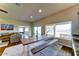 Bright dining area featuring a large window with views of the backyard and hardwood floors at 6519 E Cactus Rd, Scottsdale, AZ 85254