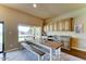 Bright dining area featuring a large window with views and wooden cabinetry at 6519 E Cactus Rd, Scottsdale, AZ 85254