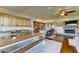 Open concept living area with kitchen, dining, living, and game room. Large fireplace included at 6519 E Cactus Rd, Scottsdale, AZ 85254