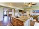 Open-concept kitchen with a large island, granite countertops, and seamless flow to the living spaces at 6519 E Cactus Rd, Scottsdale, AZ 85254