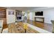 Open living room with hard wood floors, fireplace, custom shelving, and decor at 6519 E Cactus Rd, Scottsdale, AZ 85254