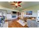 Cozy living room with stone fireplace, hardwood floors, comfortable seating, and natural light at 6519 E Cactus Rd, Scottsdale, AZ 85254
