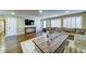Spacious living room with hard wood floors, large sectional, and custom front door at 6519 E Cactus Rd, Scottsdale, AZ 85254