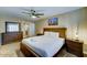 Comfortable main bedroom showcasing a queen bed, carpet flooring, and natural light at 6519 E Cactus Rd, Scottsdale, AZ 85254