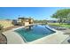 A refreshing pool is surrounded by a concrete deck and mature landscaping creating a serene outdoor oasis at 6519 E Cactus Rd, Scottsdale, AZ 85254