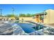 Backyard pool with an outdoor kitchen, barbecue and ample seating for entertainment at 6519 E Cactus Rd, Scottsdale, AZ 85254