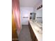 Bathroom showcasing double sinks, vanity, and large mirror at 664 N Glenview --, Mesa, AZ 85213