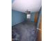Empty bedroom with blue walls, gray carpet, ceiling fan, and natural light from small window at 664 N Glenview --, Mesa, AZ 85213