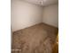 Empty bedroom with carpet flooring, ceiling fan, and white walls, ready for personalization at 664 N Glenview --, Mesa, AZ 85213