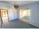 Dining room boasting a chandelier, light walls, carpet, and doorway to sunroom at 664 N Glenview --, Mesa, AZ 85213