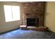 Brick fireplace with a hearth and mantel, offering a cozy focal point at 664 N Glenview --, Mesa, AZ 85213