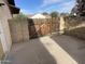 A wooden gate is securely installed between block walls, offering private backyard access at 664 N Glenview --, Mesa, AZ 85213