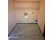 Laundry room featuring washer and dryer hookups, laminate floor, and overhead storage shelves at 664 N Glenview --, Mesa, AZ 85213
