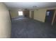 Spacious living room with carpet flooring, a brick fireplace, and good natural light at 664 N Glenview --, Mesa, AZ 85213