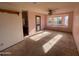 Spacious living room with carpet flooring, bay window, and neutral paint at 664 N Glenview --, Mesa, AZ 85213