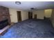Open-concept living room featuring a brick fireplace and doorway to an adjacent room at 664 N Glenview --, Mesa, AZ 85213