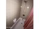 Bathroom shower with adjustable shower head and pink curtain at 664 N Glenview --, Mesa, AZ 85213