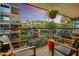 The outdoor balcony overlooks manicured greenery and the surrounding city landscape at 7167 E Rancho Vista Dr # 5001, Scottsdale, AZ 85251
