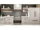 Close-up of modern kitchen featuring professional-grade appliances, marble countertops, and stylish cabinetry at 7167 E Rancho Vista Dr # 5001, Scottsdale, AZ 85251