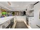 Elegant white kitchen featuring stainless steel appliances, marble countertops, and ample storage at 7167 E Rancho Vista Dr # 5001, Scottsdale, AZ 85251