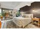 This inviting bedroom offers an eye-catching accent wall and relaxing balcony with city views at 7167 E Rancho Vista Dr # 5001, Scottsdale, AZ 85251