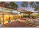 Charming patio with outdoor grill, fire pit, and exterior view with a full glass wall offering indoor/outdoor living at 7167 E Rancho Vista Dr # 5001, Scottsdale, AZ 85251