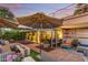 Stylish patio featuring an outdoor fire pit, seating area, and glass walls, perfect for relaxation and entertaining at 7167 E Rancho Vista Dr # 5001, Scottsdale, AZ 85251