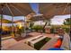 Beautiful patio with fire pit, grill, lounge seating, and lush landscaping at 7167 E Rancho Vista Dr # 5001, Scottsdale, AZ 85251