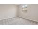 Bright bedroom with neutral carpet and a clear view from the window at 7229 E Cattle Call St, San Tan Valley, AZ 85143