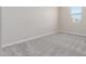 Neutral bedroom featuring a window for natural light and neutral carpet at 7229 E Cattle Call St, San Tan Valley, AZ 85143