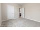 Neutral bedroom featuring soft carpet, pale walls, and open doorway at 7229 E Cattle Call St, San Tan Valley, AZ 85143