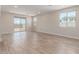 Bright living room features large windows and sliding glass door, with tile floors at 7229 E Cattle Call St, San Tan Valley, AZ 85143