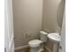 A half bathroom with a pedestal sink, tile flooring, and neutral paint, offering a convenient space for guests at 7229 E Cattle Call St, San Tan Valley, AZ 85143