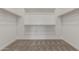 Spacious walk-in closet featuring carpeted floor and wood shelving at 7229 E Cattle Call St, San Tan Valley, AZ 85143