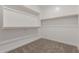 Bright walk-in closet with neutral carpet and ample shelving at 7229 E Cattle Call St, San Tan Valley, AZ 85143
