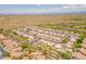 Aerial view showcasing a community with tile roof homes, some with private pools and lush desert surroundings at 7297 E Black Rock Rd, Scottsdale, AZ 85255