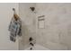The bathroom features neutral tile, a tiled niche, and a shower head, offering a spa-like experience at 7297 E Black Rock Rd, Scottsdale, AZ 85255