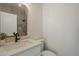 Bathroom featuring a vanity, quartz countertop, vessel sink and framed mirror, complemented by soft grey tile at 7297 E Black Rock Rd, Scottsdale, AZ 85255