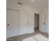 The bedroom features neutral walls, tile flooring, sliding-door closets, and ample storage at 7297 E Black Rock Rd, Scottsdale, AZ 85255
