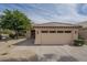Charming single-story home with a two-car garage, desert landscaping, and a well-maintained front yard at 7297 E Black Rock Rd, Scottsdale, AZ 85255
